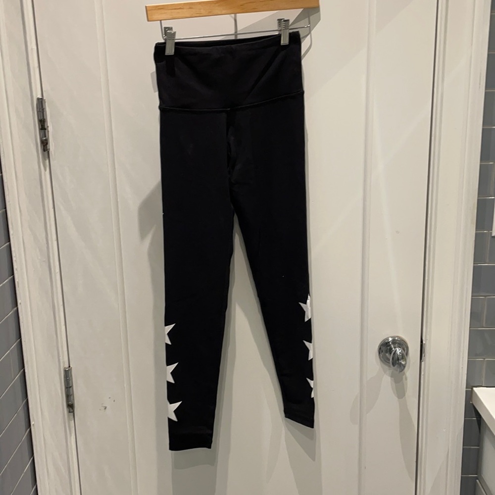 Strut this black leggings with white stars